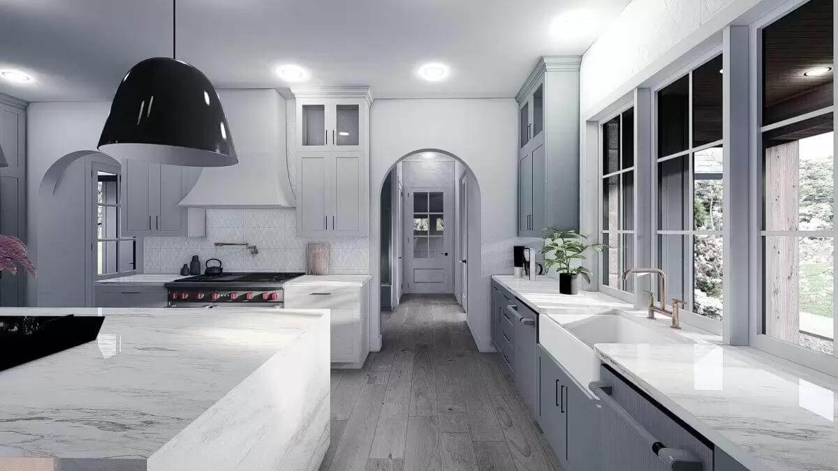 Large windows above the sink bring natural light into the kitchen.