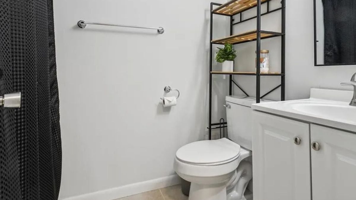 A bathroom with a vanity and a toilet.