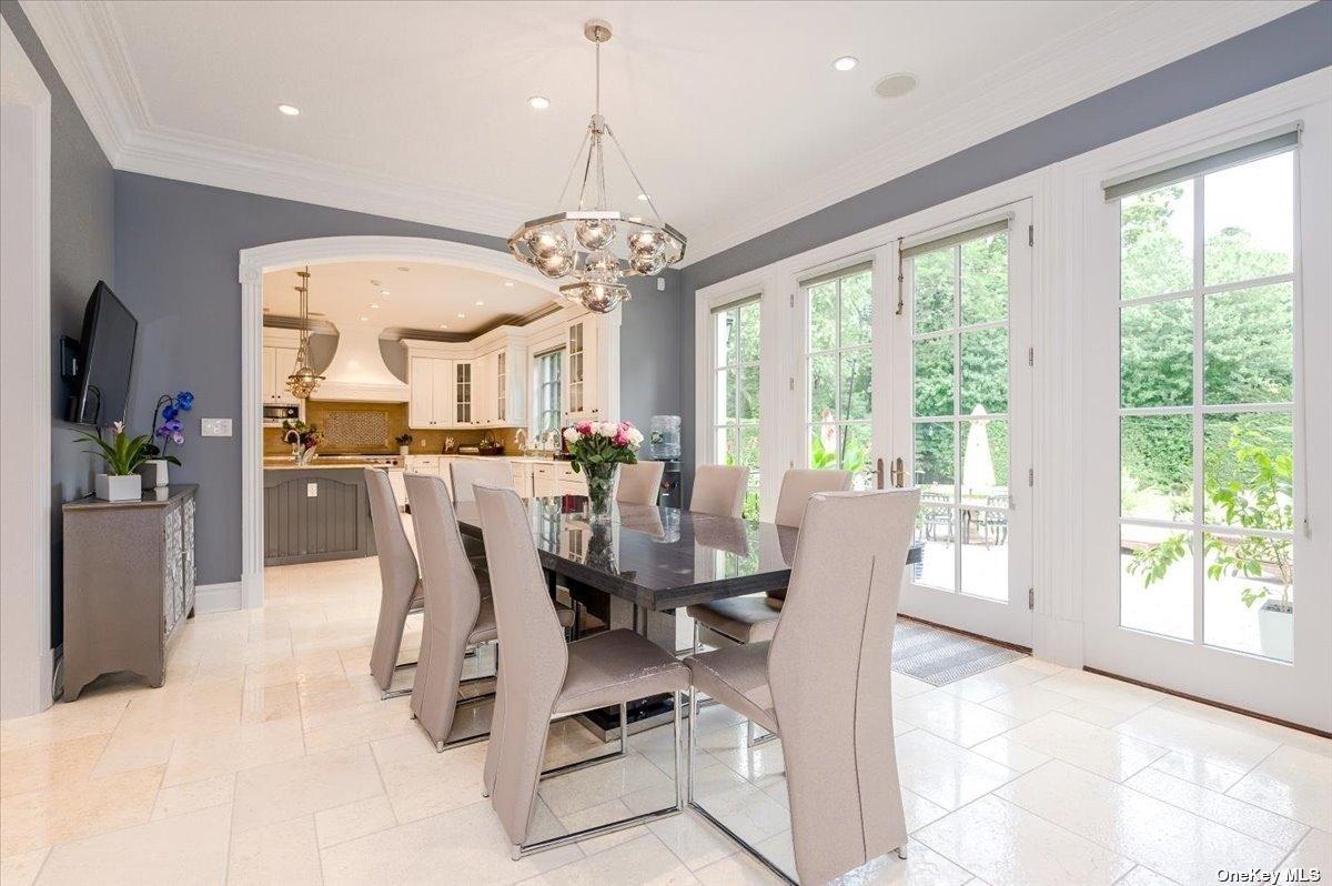 Dining room with a chandelier.