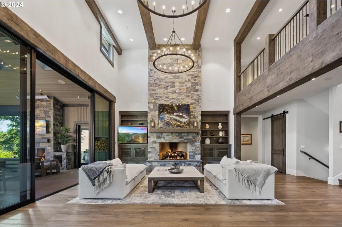 Living room with a fireplace and hardwood floors.