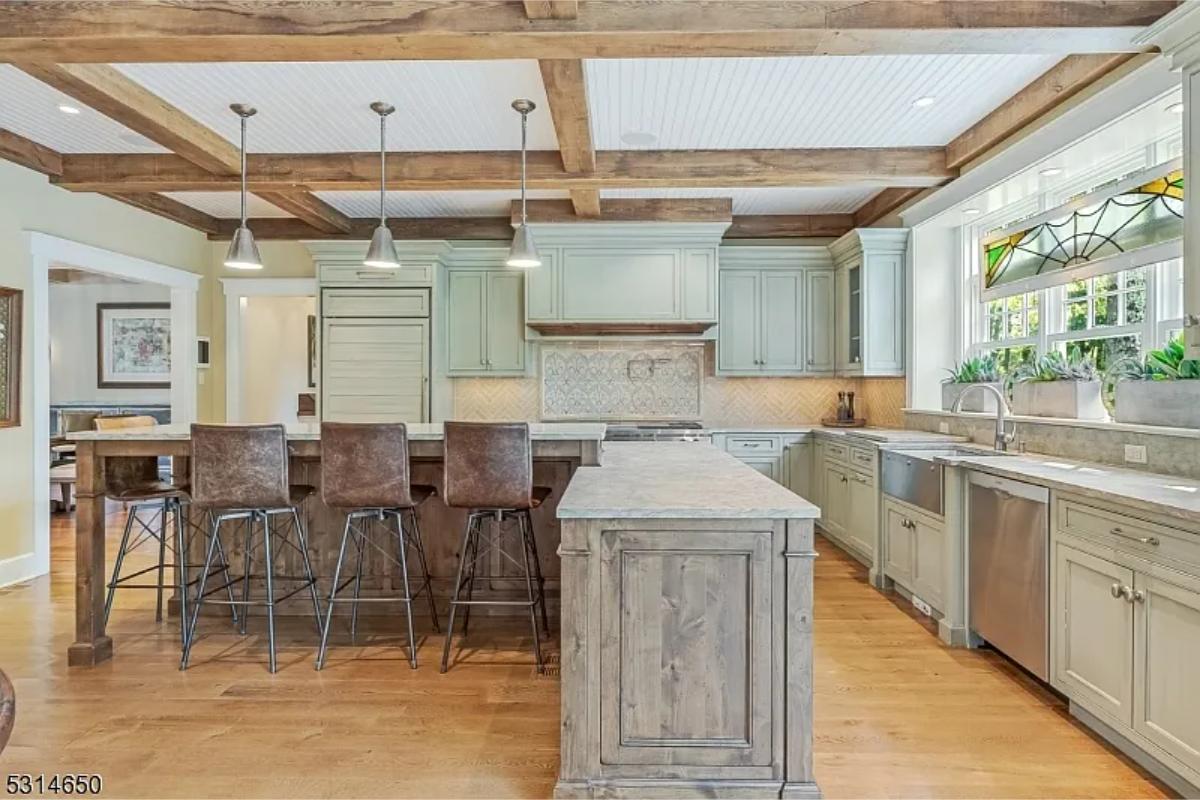 Kitchen with custom cabinetry and a counter breakfast bar.