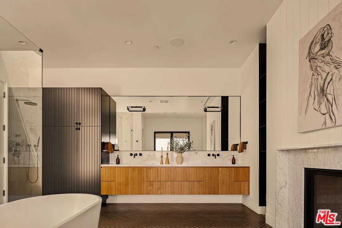 Bathroom with a custom-made vanity, a soaking tub and a walk-in shower.