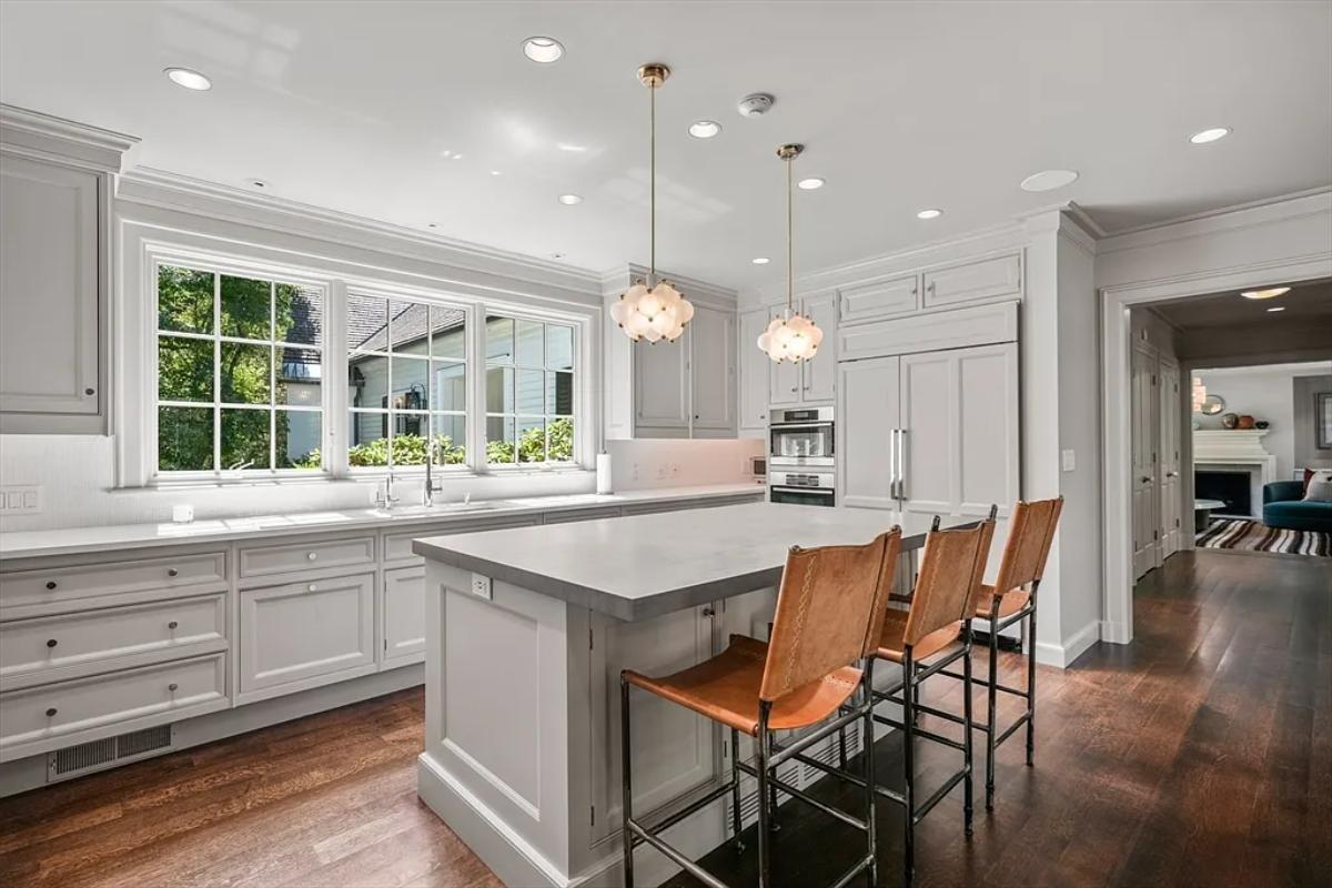 Kitchen with custom cabinetry and a counter breakfast bar.