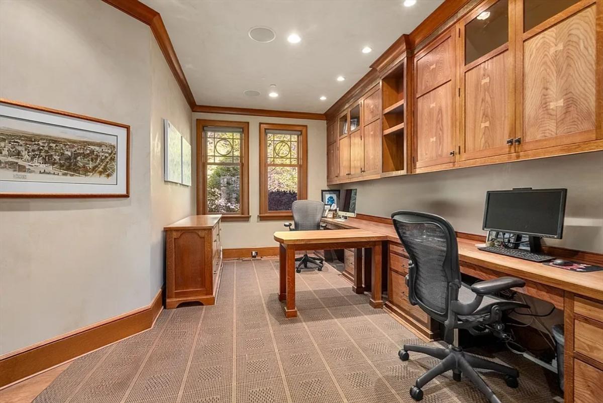 Home office with custom cabinetry.