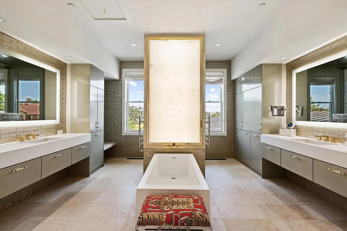 Bathroom with a custom-made vanity and a soaking tub.