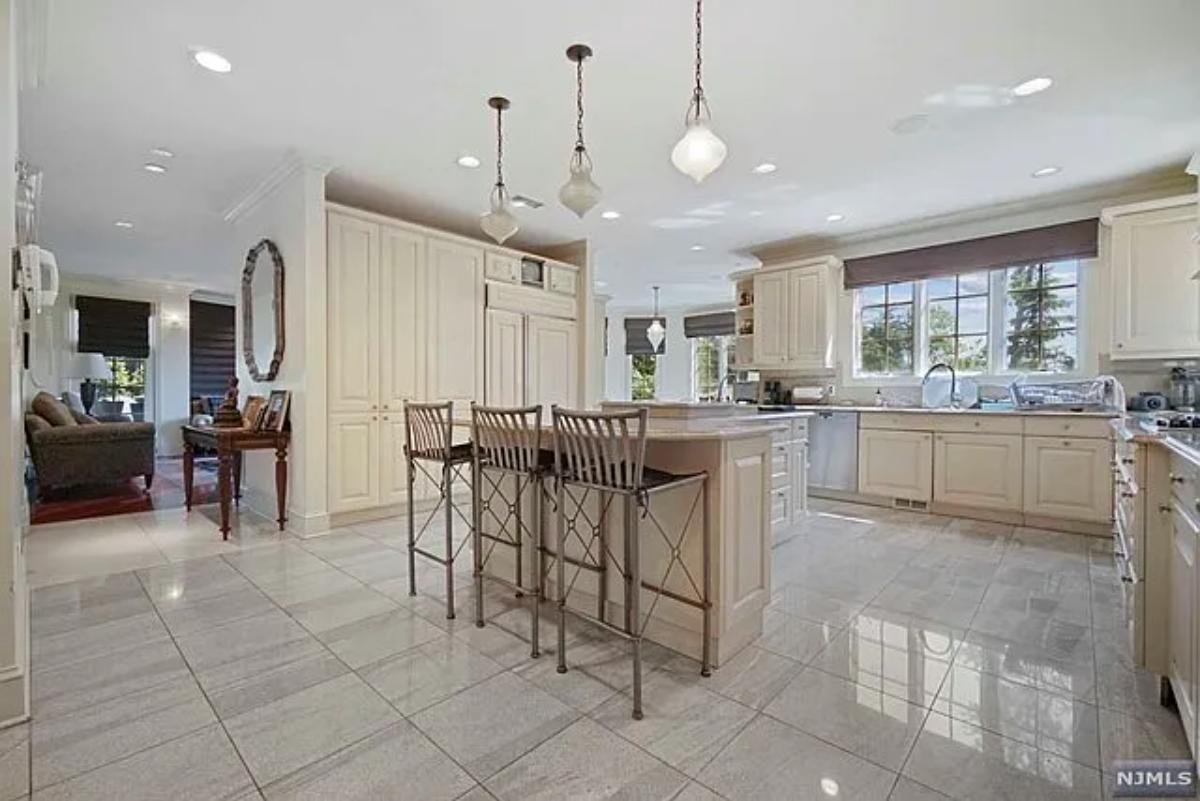 Kitchen with custom cabinetry and a counter breakfast bar.
