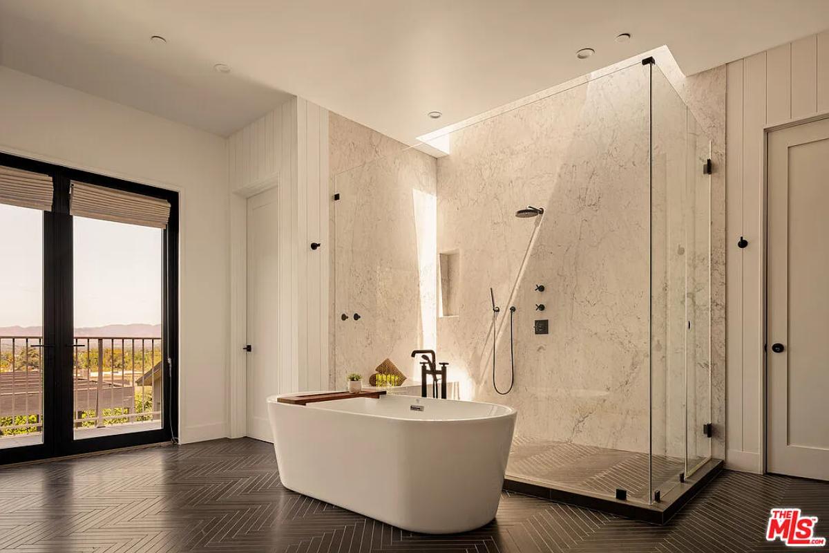 Bathroom with a soaking tub and a walk-in shower.
