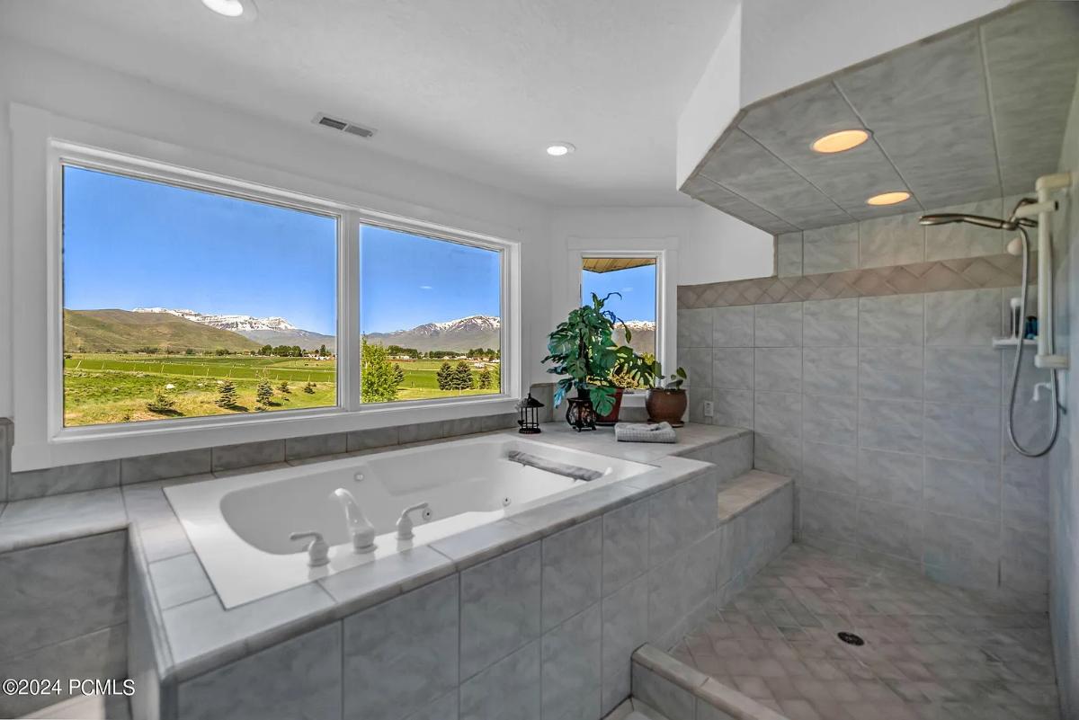Bathroom with a soaking tub and a shower.