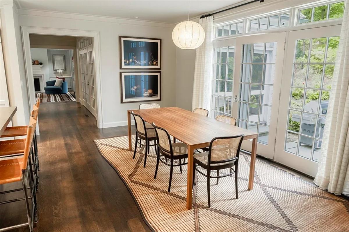 Breakfast nook with a hardwood table.