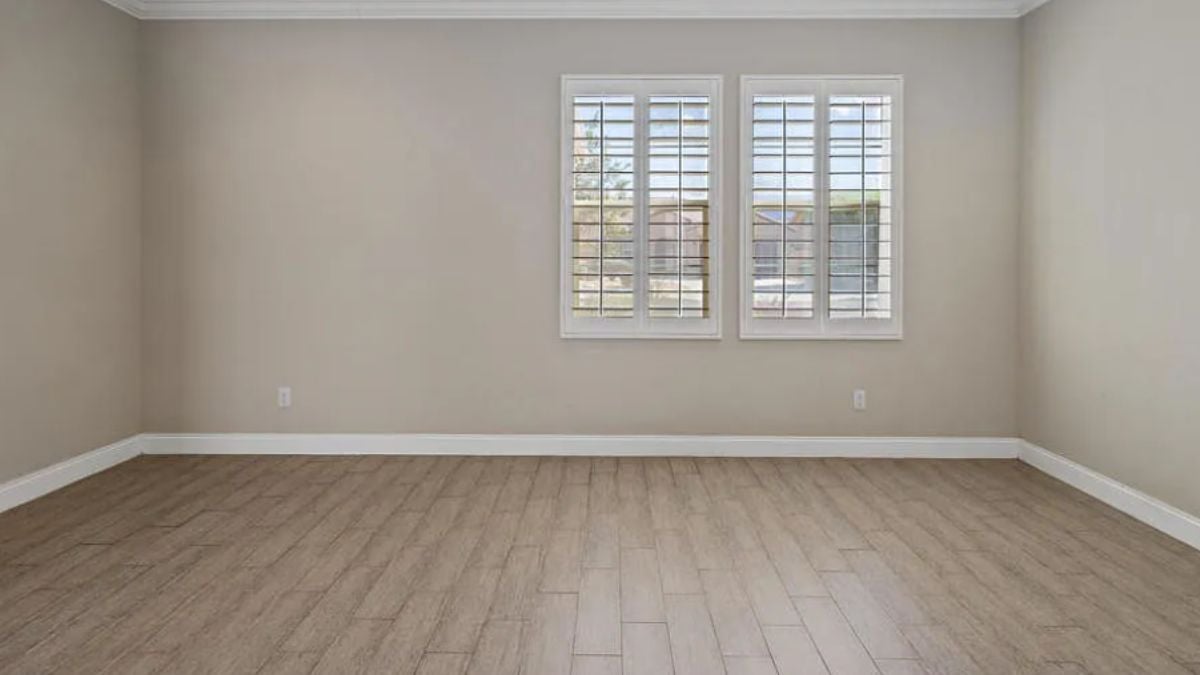 A bedroom with a window.