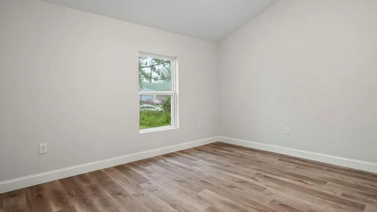 A bedroom with a window.