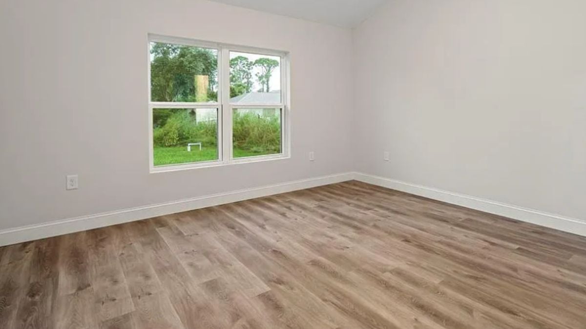 A bedroom with a window.