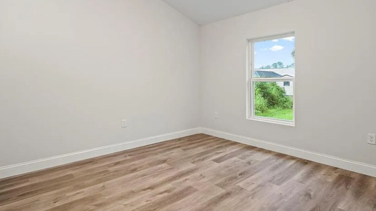 A bedroom with window.