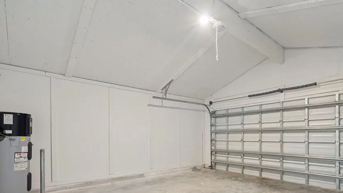 An indoor garage with a vaulted ceiling.