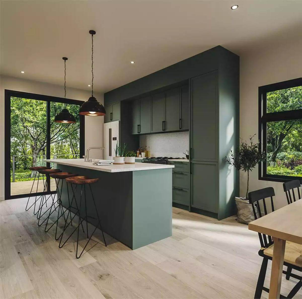 Kitchen with custom cabinetry and a matching island paired by round bar stools.