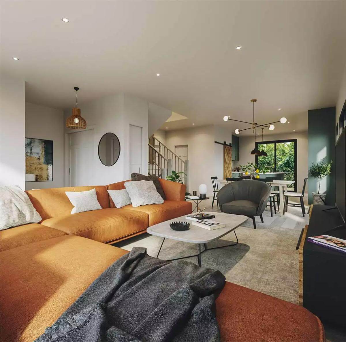 Living room showcasing the L-shaped sofa, round back chair, and iron coffee table over the area rug.