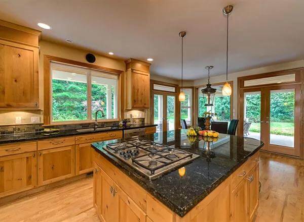 Kitchen adjoined by a breakfast nook.