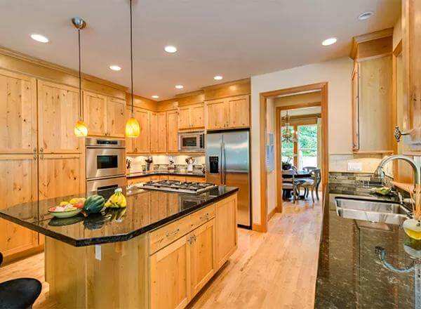 The kitchen includes modern appliances and double sinks.