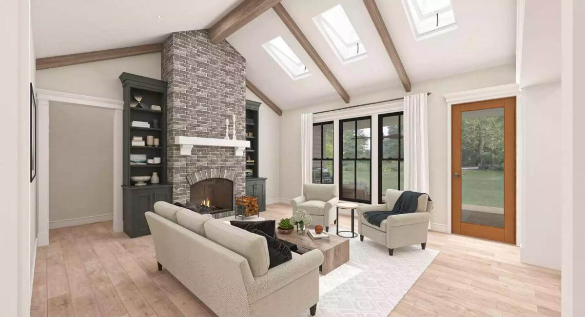 Living room with beige seats, a brick fireplace, and a cathedral ceiling highlighted by exposed beams.