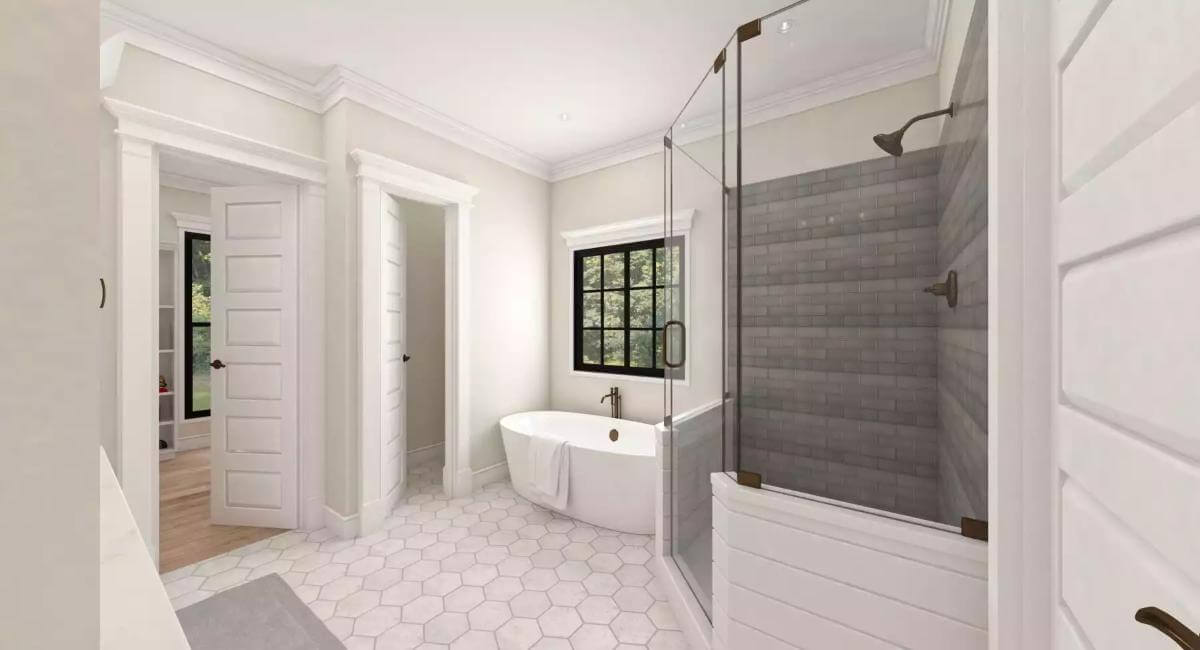 Primary bathroom with a corner shower and a soaking tub over the hex tiled flooring.