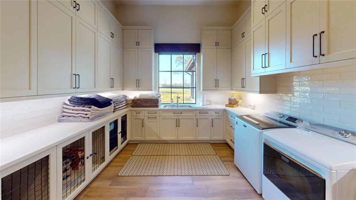 Laundry room with hardwood floors.