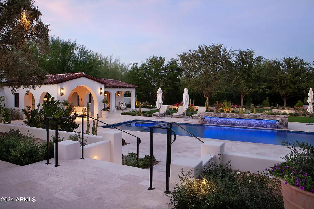 Pool with lounge chairs.