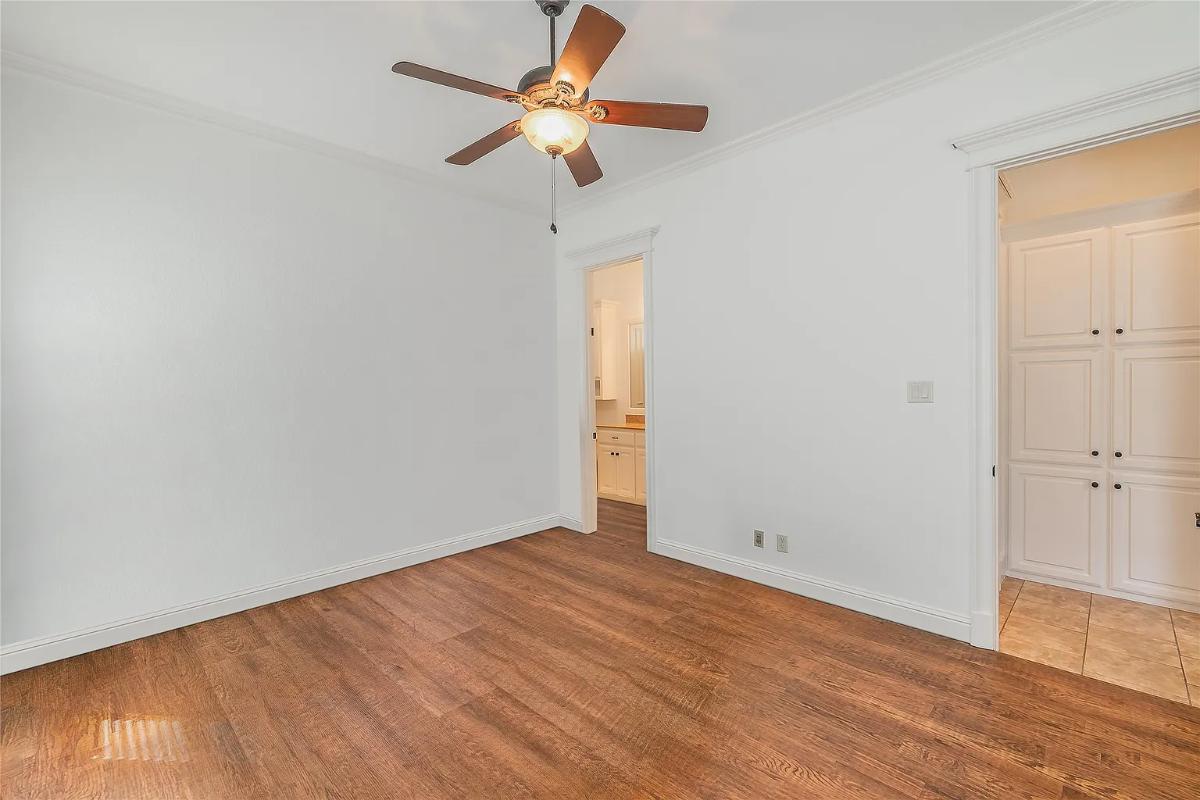 Bedroom with hardwood floors.