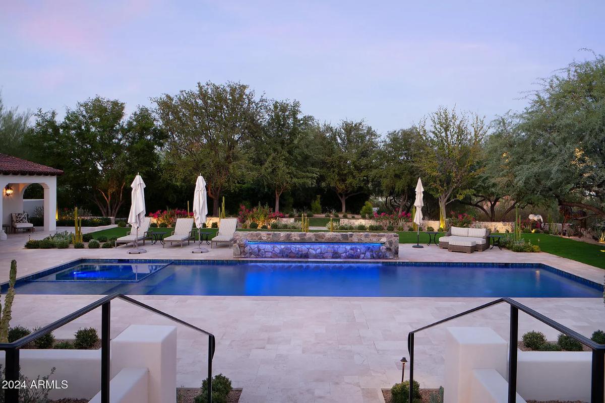 Pool with lounge chairs.