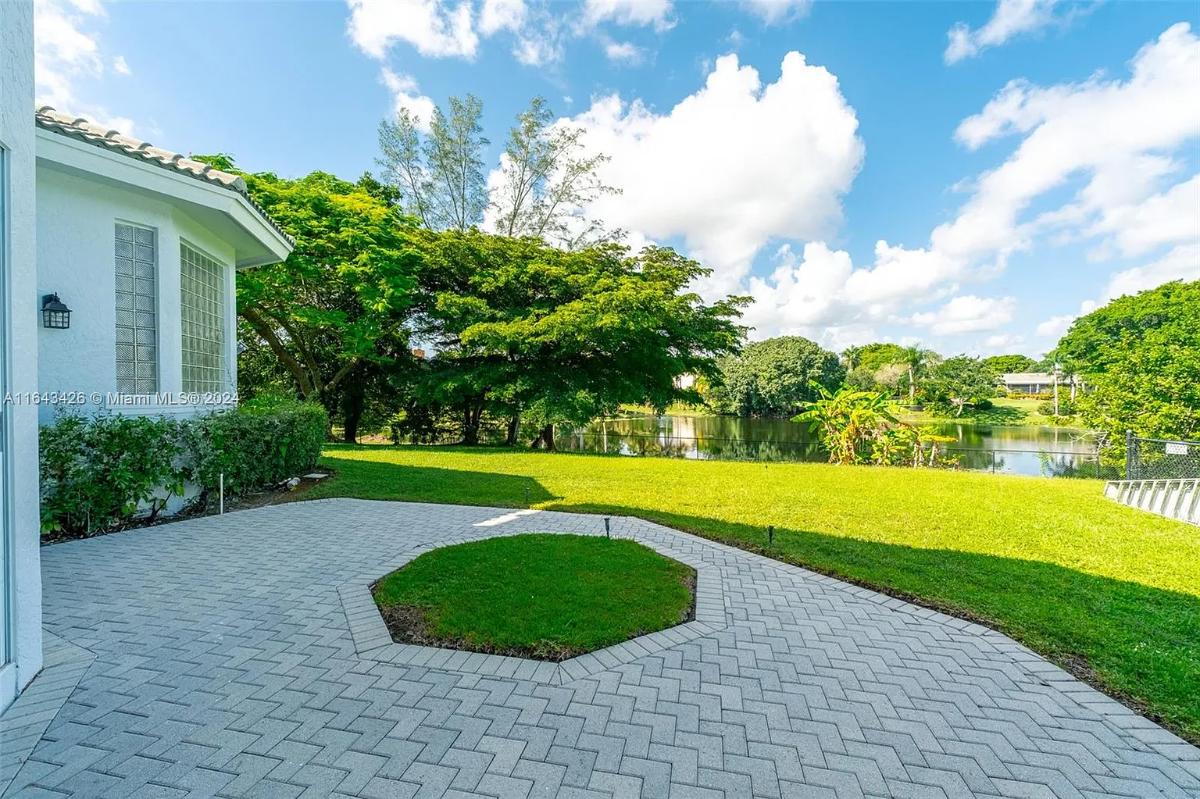 Patio with a large green lawn.