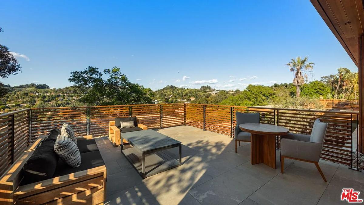 Terrace with tables and chairs.