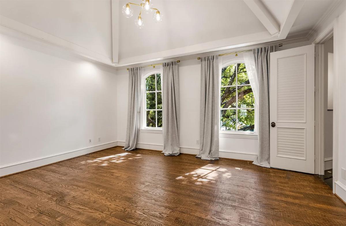 Bedroom with hardwood floors.