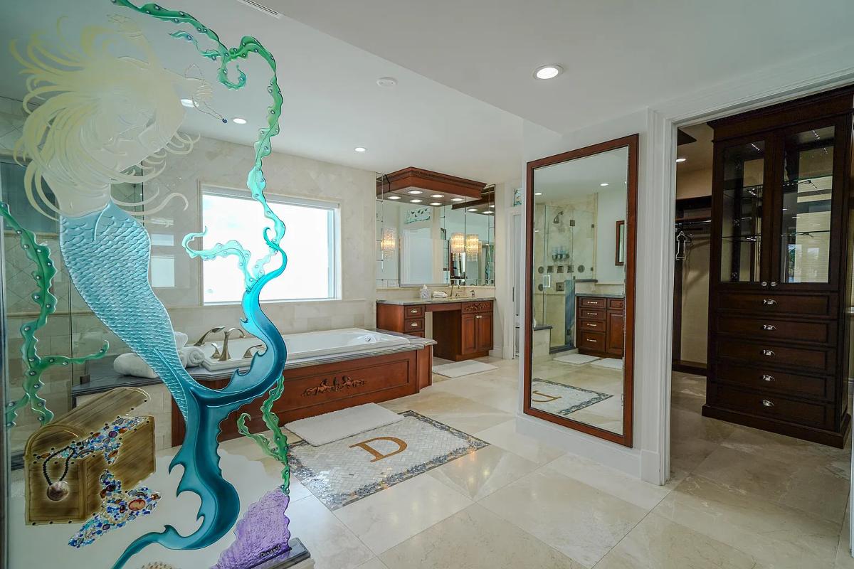Bathroom with a custom-made vanity and a soaking tub.