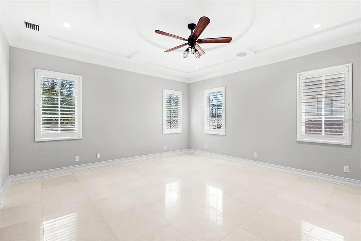 Bedroom with tile flooring.