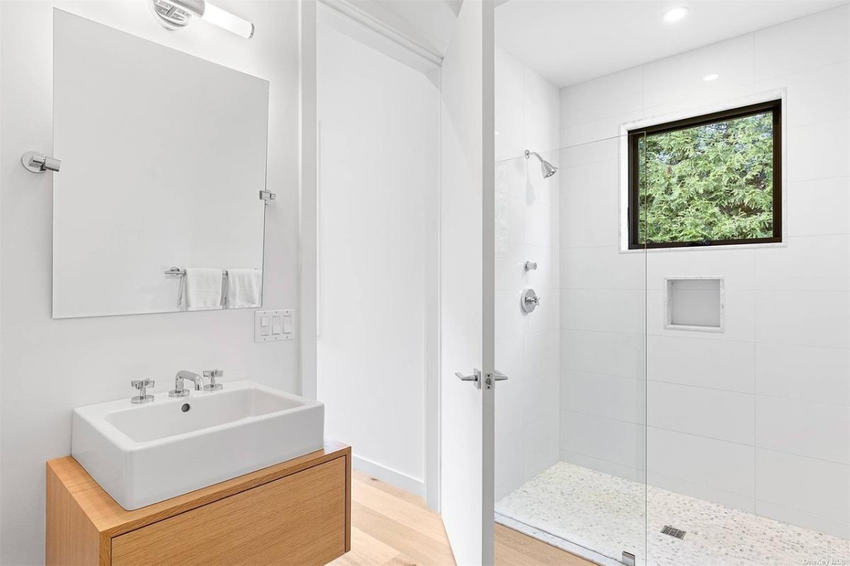 Bathroom with a sink and a walk-in shower.