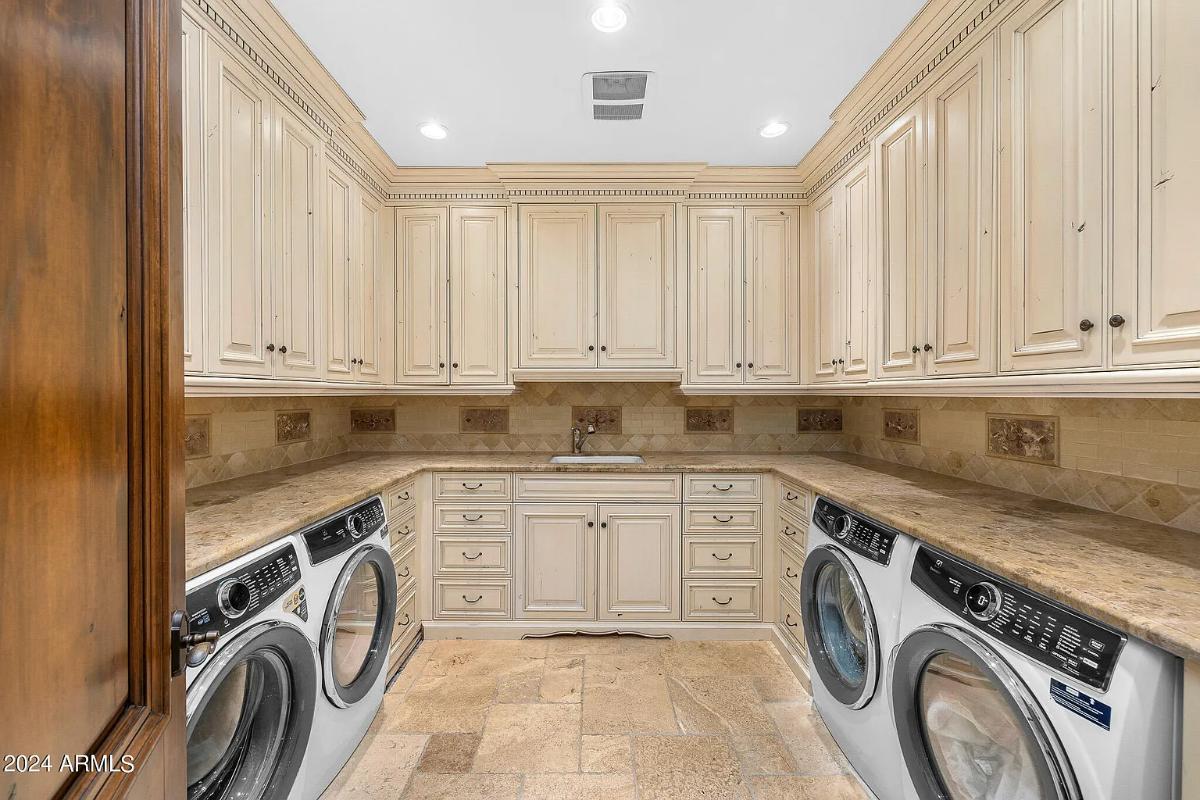 Laundry room with custom cabinetry.