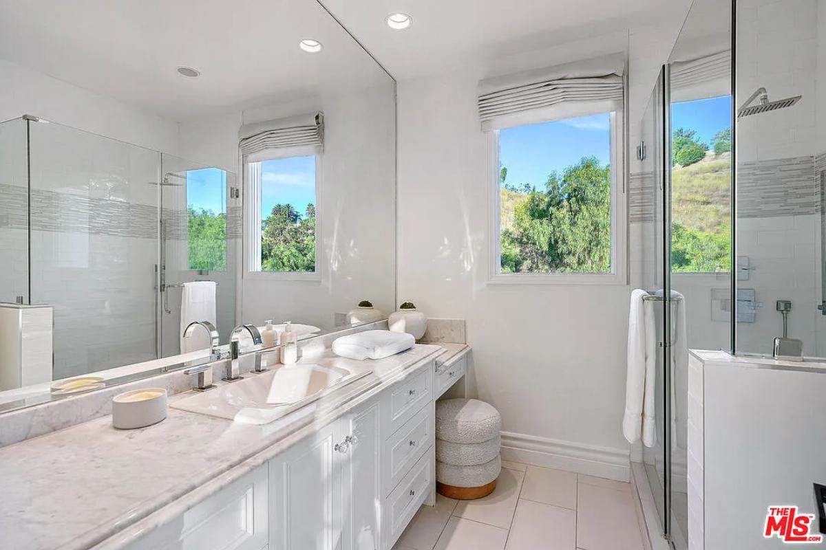 Bathroom with a sink and a walk-in shower.