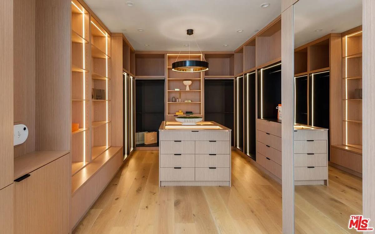 Walk-in closet with custom lighting.