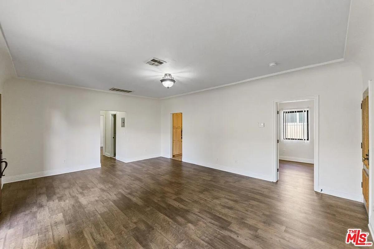 Bedroom with hardwood floors.