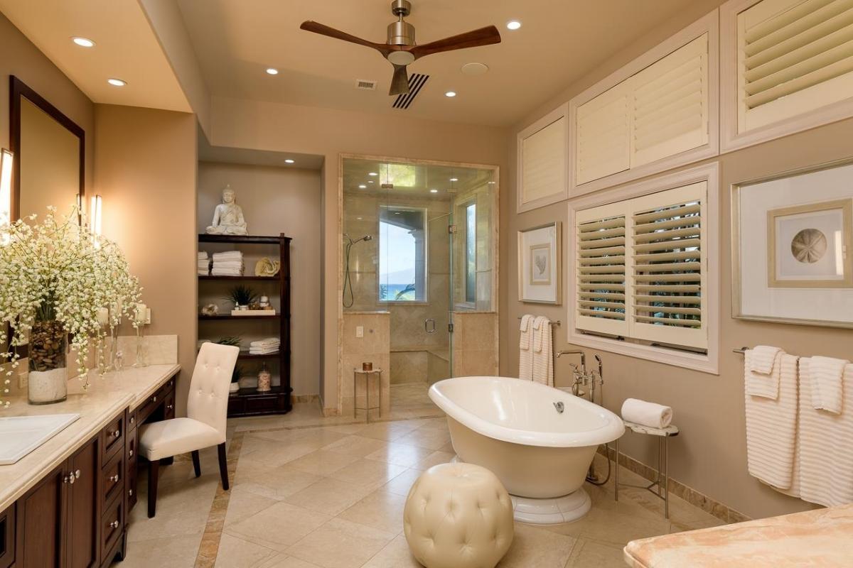 Bathroom with a custom-made vanity, a soaking tub and a walk-in shower.