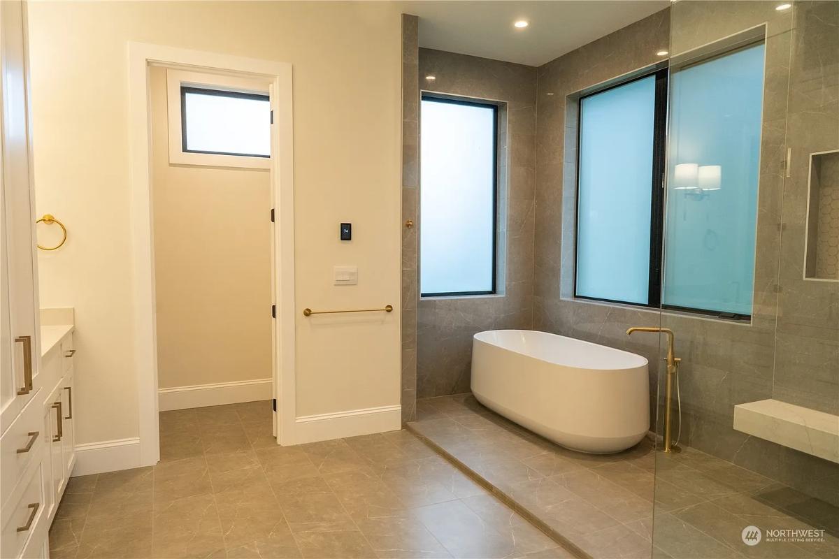 Bathroom with a soaking tub and a walk-in shower.
