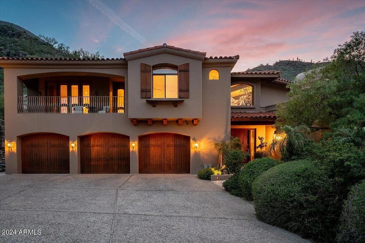 Garage with a spacious driveway.