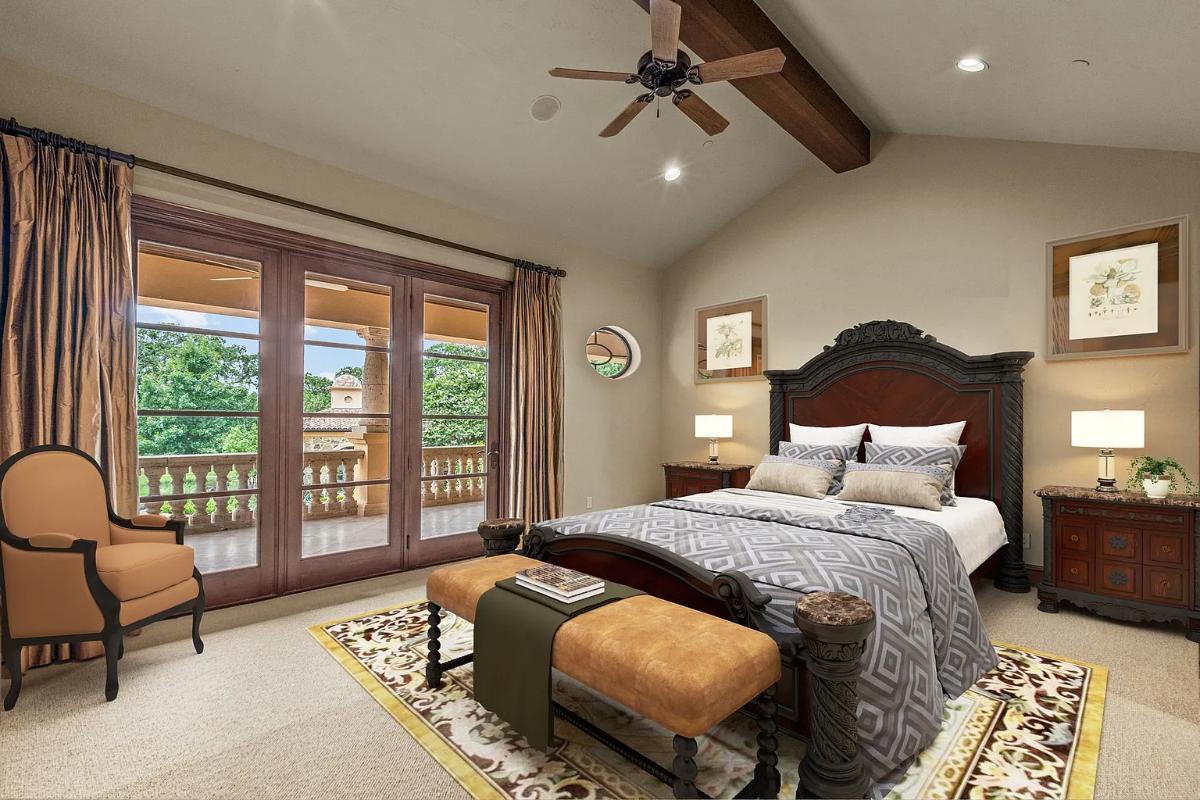 Bedroom with a large bed and carpet flooring.