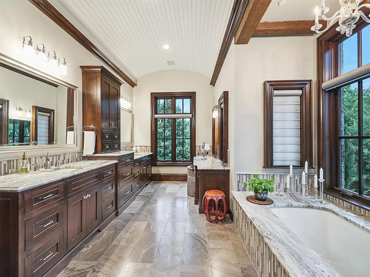 Bathroom with a custom-made vanity and a soaking tub.