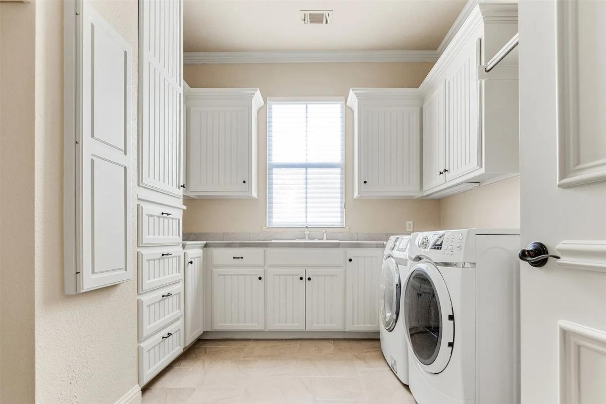 Laundry room with custom cabinetry.