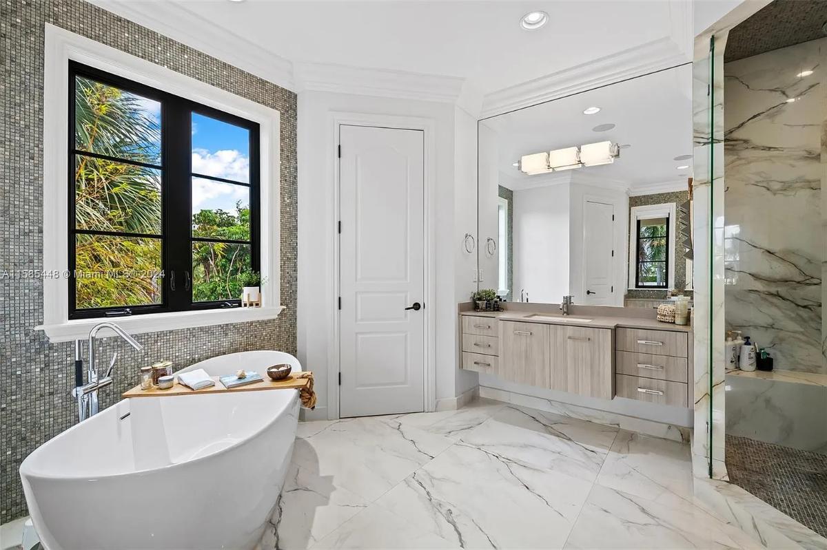 Bathroom with a soaking tub and a walk-in shower.