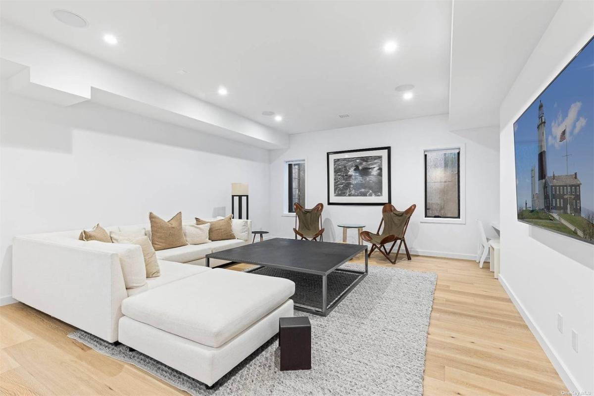 Family room with couches and a TV.