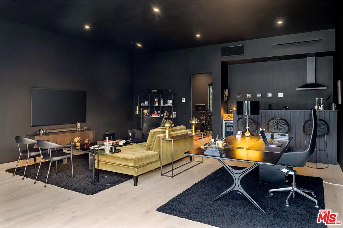 Recreation room with a living space and a bar.