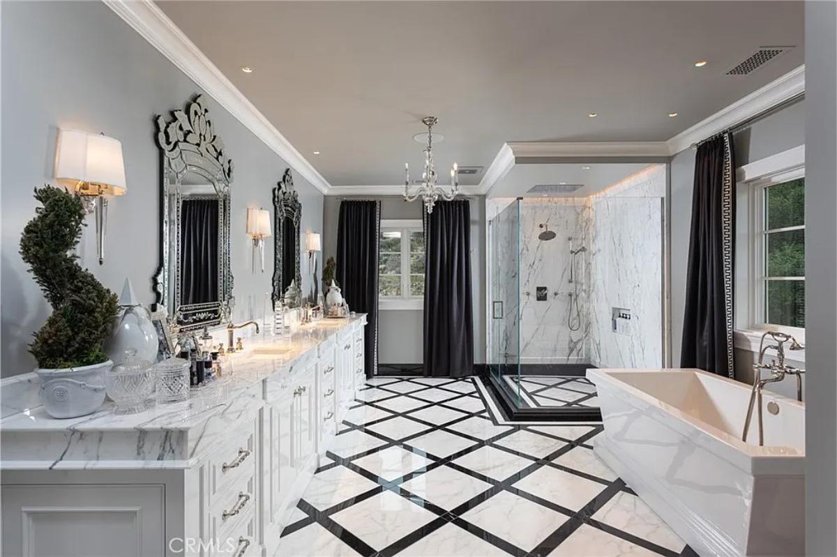 Bathroom with a custom-made vanity, a soaking tub and a walk-in shower.