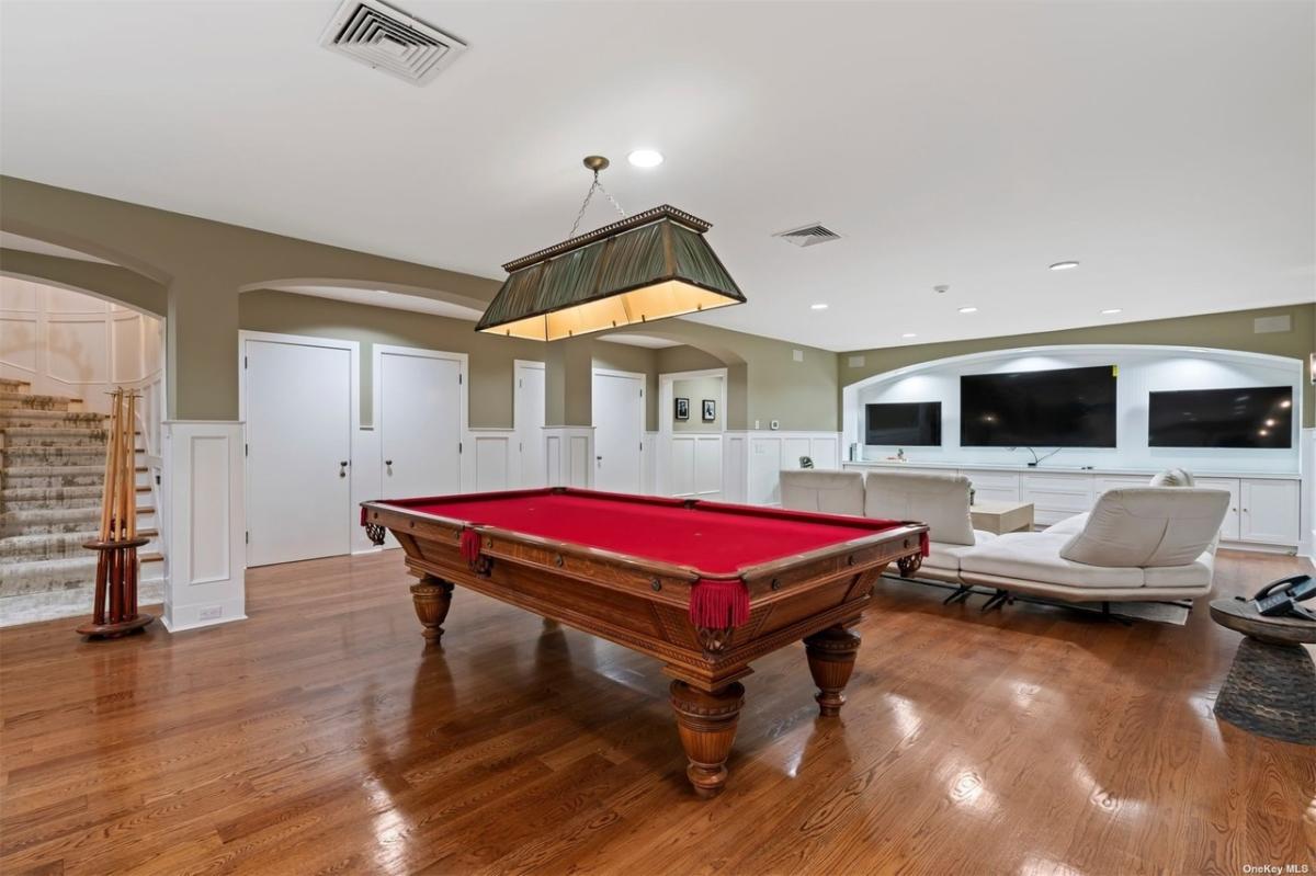 Recreation room with a billiards table.
