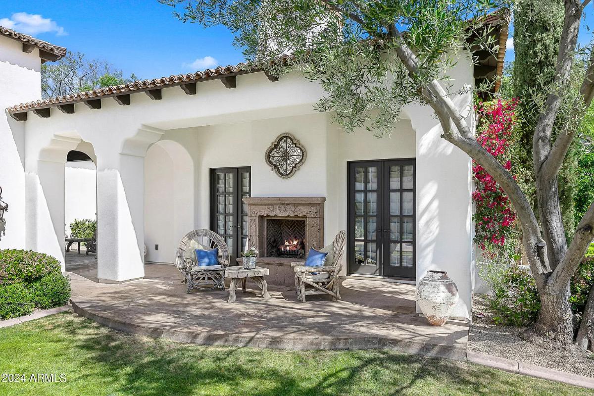 Patio with a fireplace.